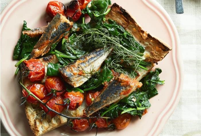 Nuri sardines close-up showing flaky texture and glossy tomato sauce.