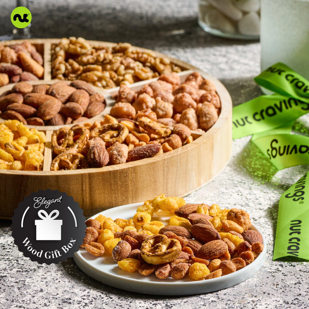 Nut Cravings reusable round wooden tray showcases the snack assortment for easy gifting