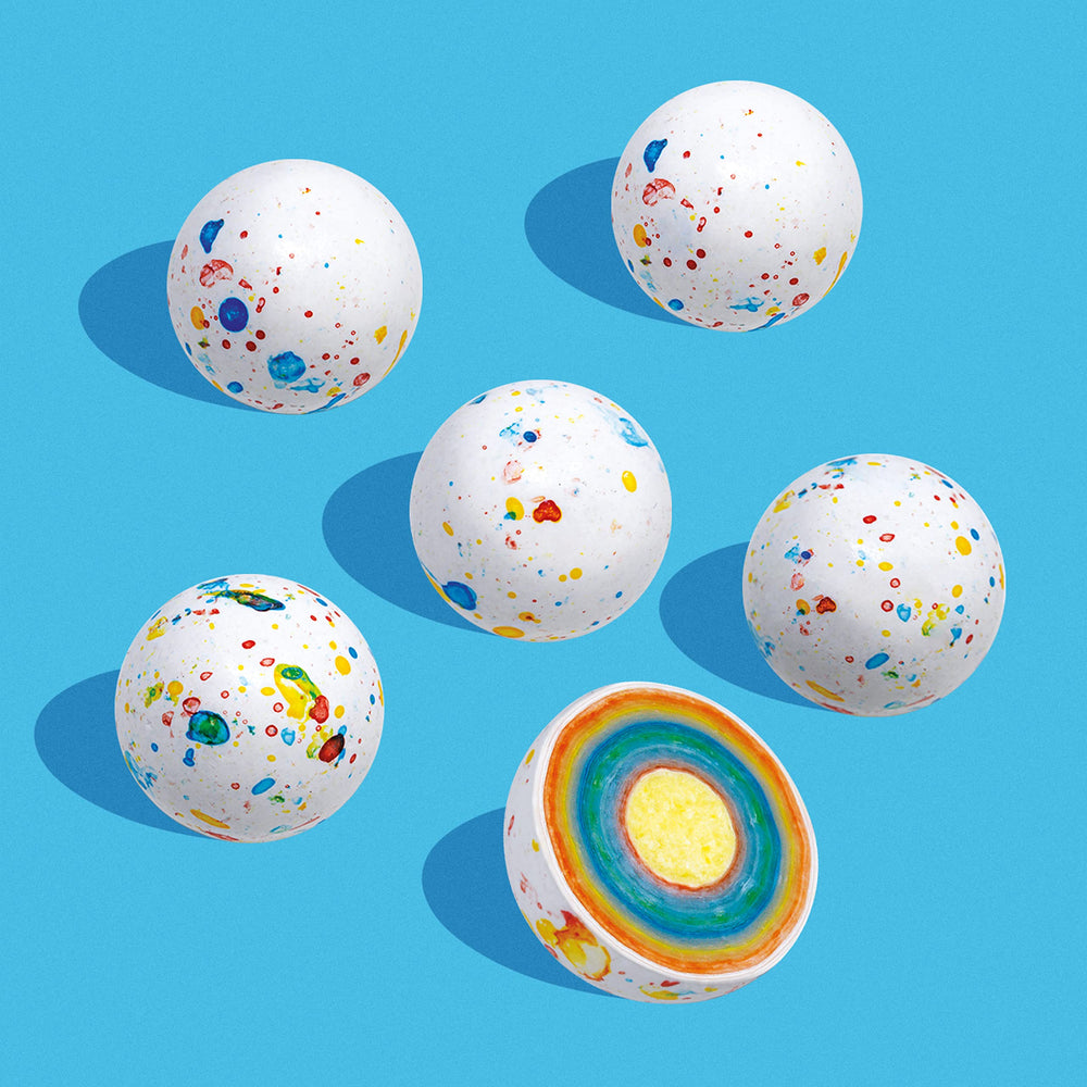 Nutic colorful gobstoppers decorate a wedding candy bar.