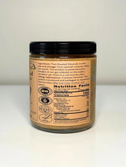 Nutrica Organics almond butter jar open, creamy texture ready to scoop