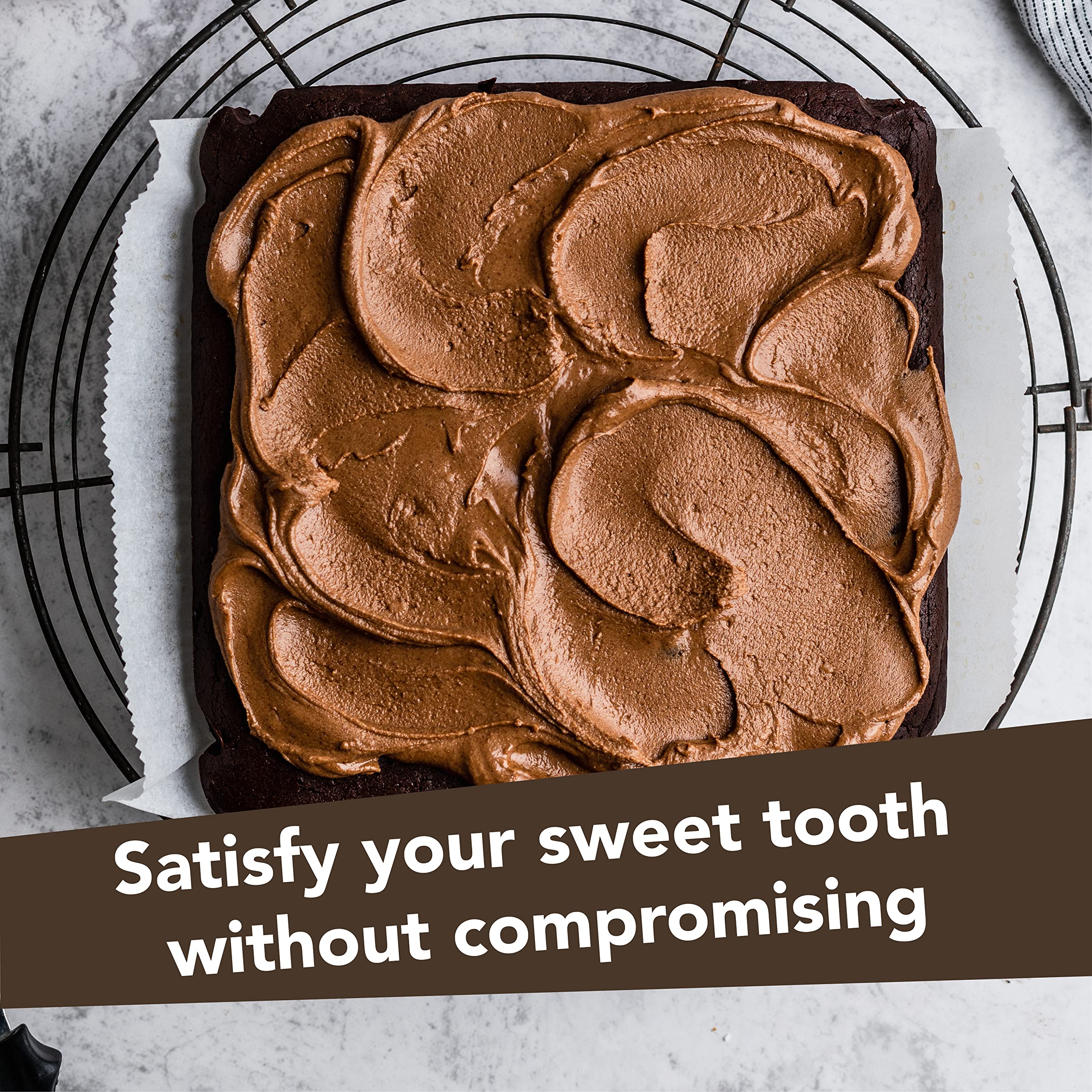 Nuts 'N More Dark Chocolate Almond Butter Spread on fruit slice for keto-friendly indulgence