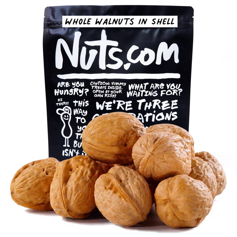 Nuts.com whole walnuts in shell close-up showing fresh, beginner-friendly cracking and baking prep.