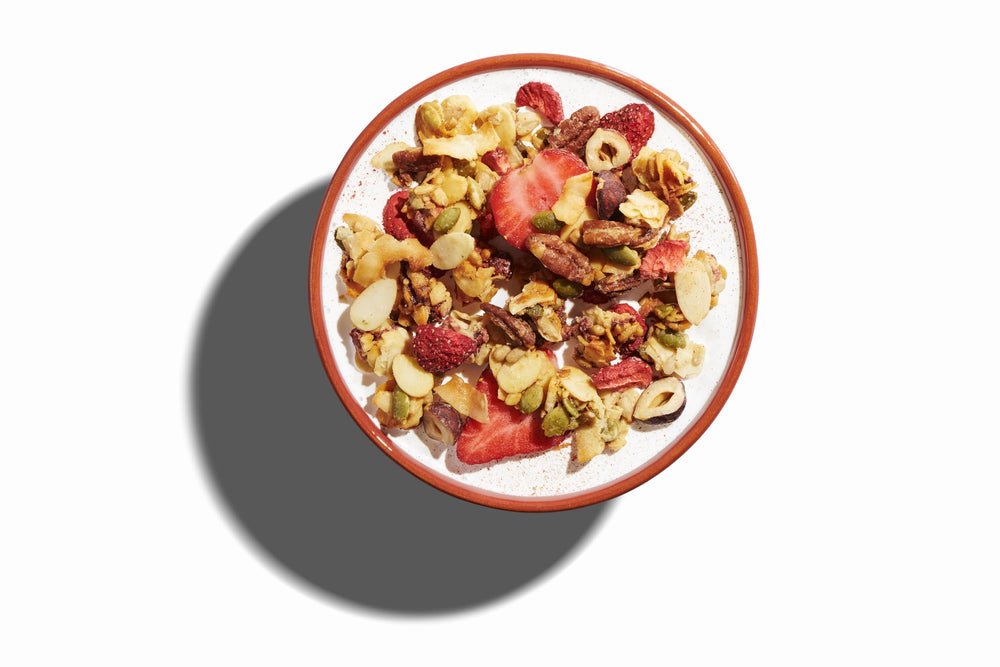 Close-up of NuTrail ingredients highlighting berry pieces and crunchy clusters.