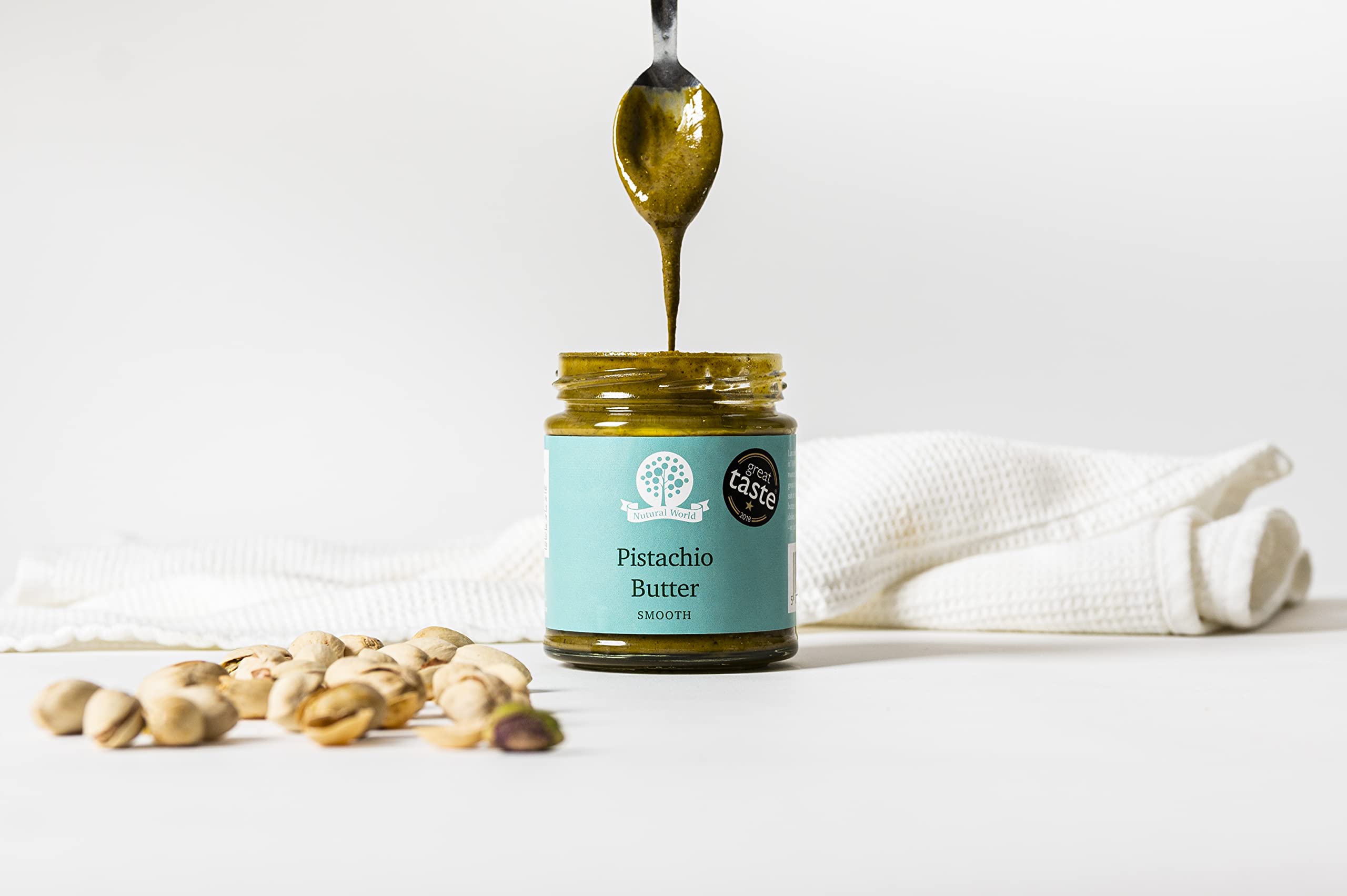 Nutural World pistachio butter jar spread demonstrates easy deliciousness for toast and snacks.