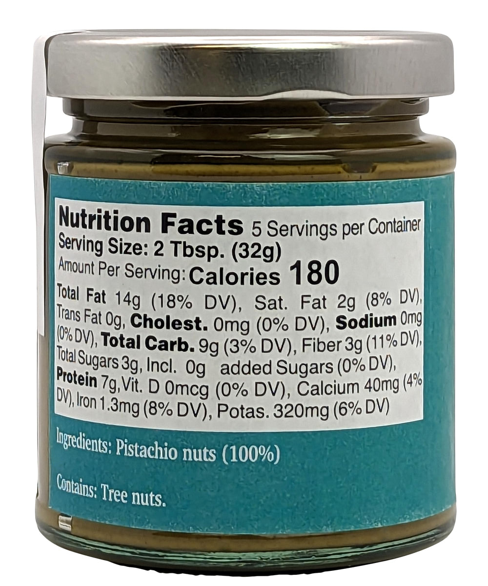 Nutural World pistachio butter texture closeup shows velvety paste and natural specks.
