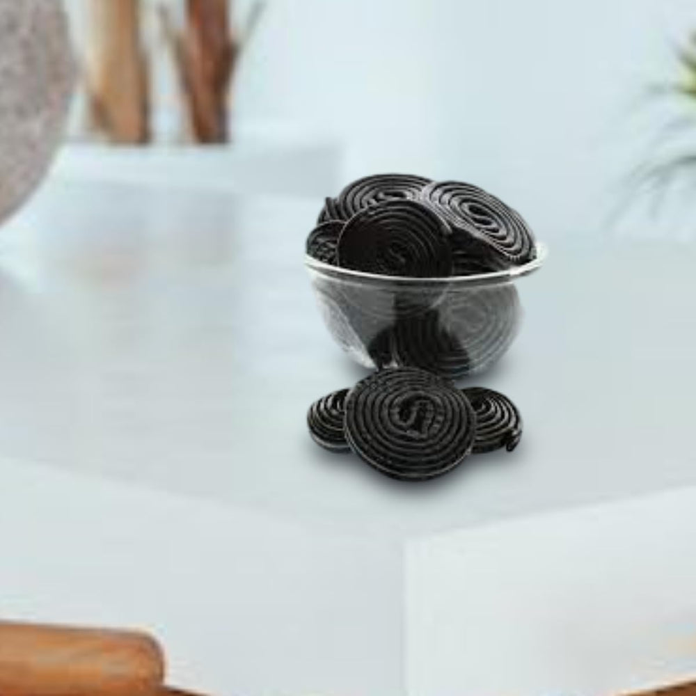 OBELYS licorice wheels paired with tea or coffee for a nostalgic treat.