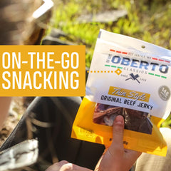 Oberto Original Beef Jerky pack in hand—great road-trip snack.