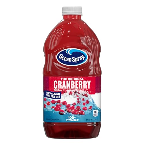 Ocean Spray Cranberry Juice Cocktail bottle pouring into a glass on ice for a refreshing drink.