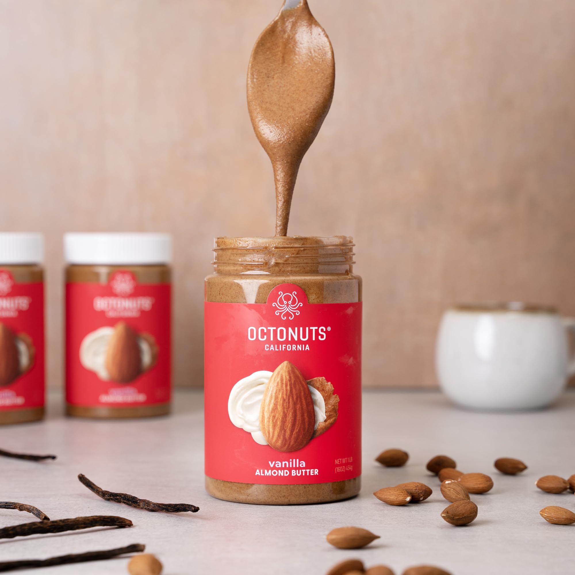 OCTONUTS Glass jar with spoon emphasizes premium packaging and easy scooping.
