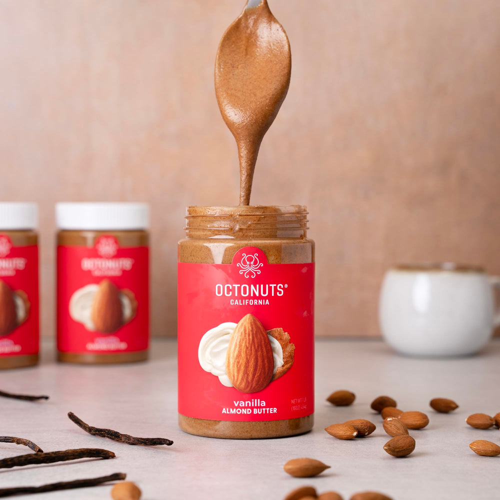 OCTONUTS Glass jar with spoon emphasizes premium packaging and easy scooping.