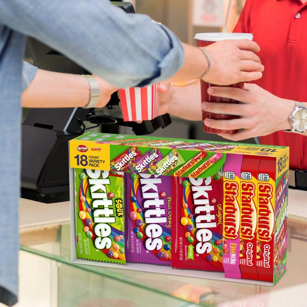 Skittles and Starburst display on table for wedding or baby shower.
