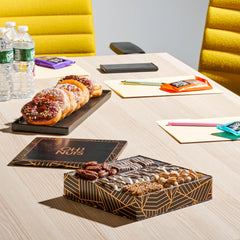 Oh! Nuts pretzels and nuts selection on a lined tray.