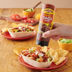 Old El Paso tacos on a plate with sauce for flavorful meal