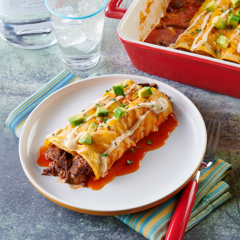 Old El Paso Mild Red Enchilada Sauce simmer in a pot for hearty stews.