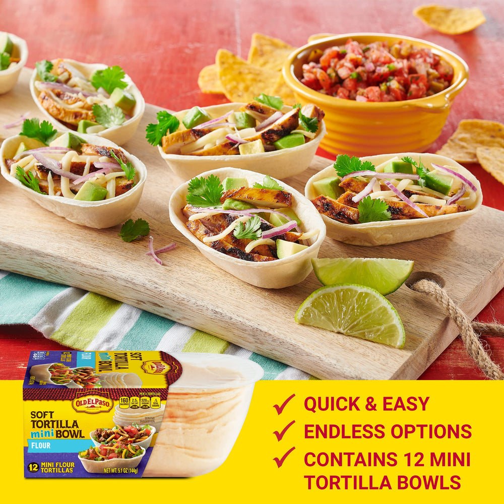 Mini tortilla bowls filled with meat and toppings for a tasty bite