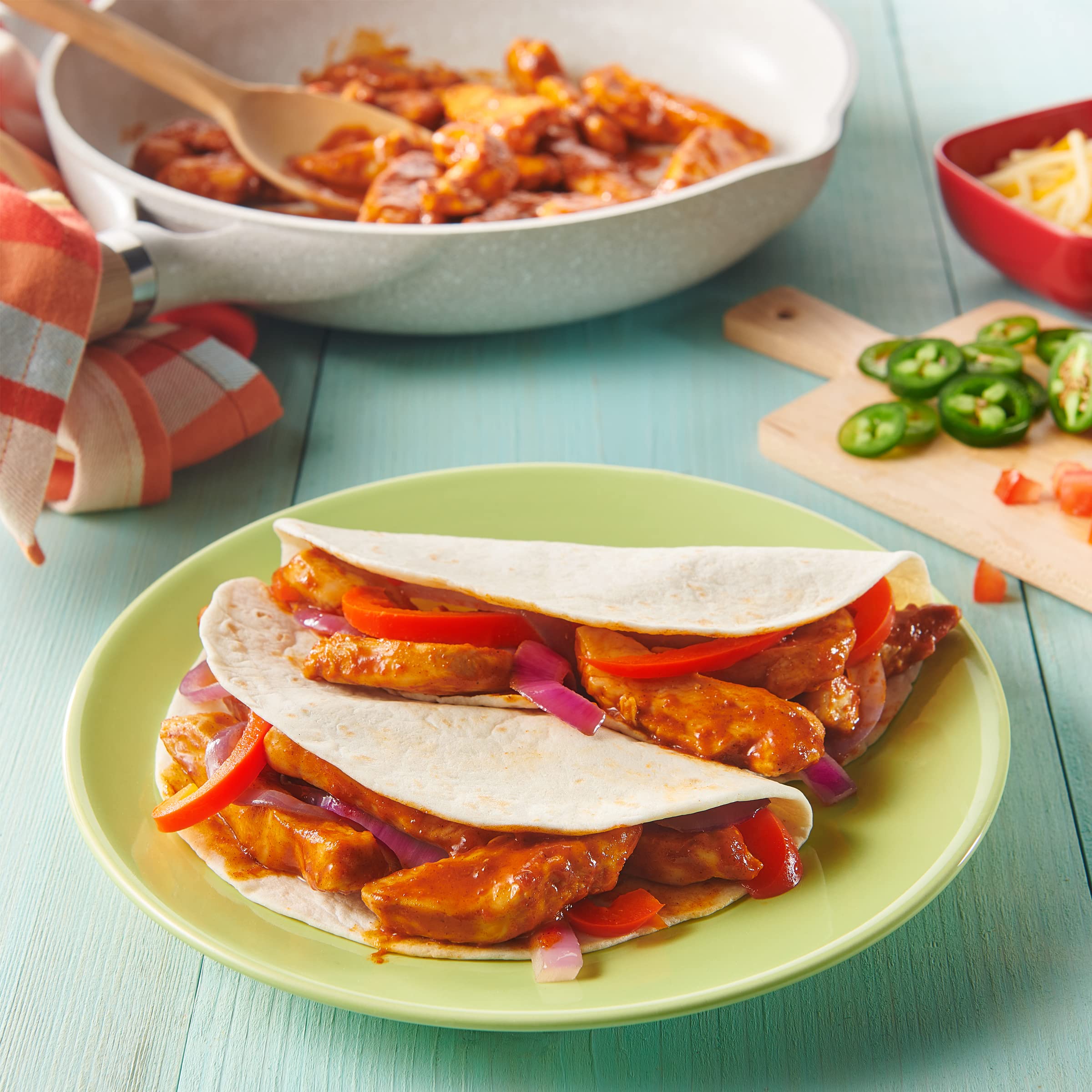 Assembled Old El Paso tacos with toppings for personalized flavor.