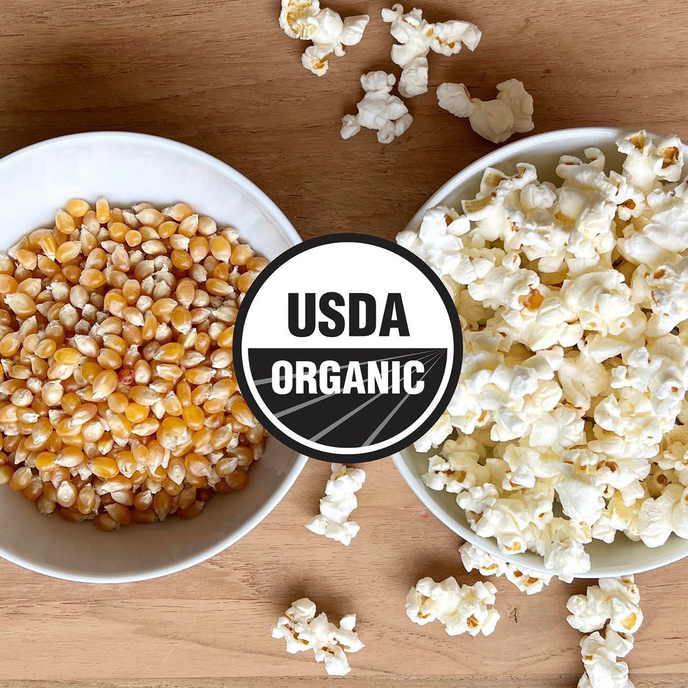 Olde World Popcorn non-GMO seal on packaging signaling clean ingredients.