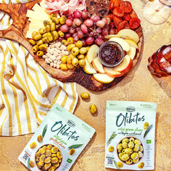 Olibites pitted black olives in a close-up view showing glossy marinated surface