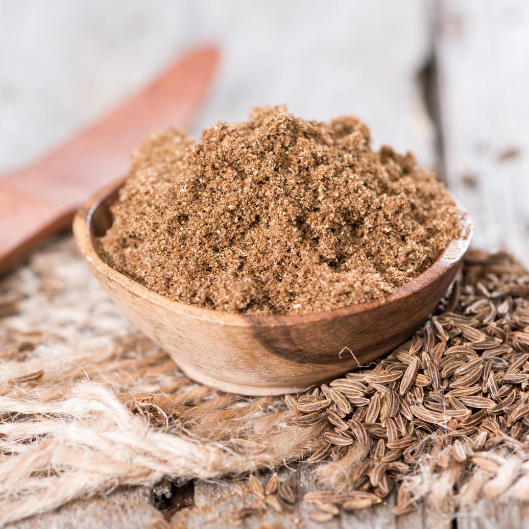 Olive & Vine ground caraway seeds on baking bread for aroma.