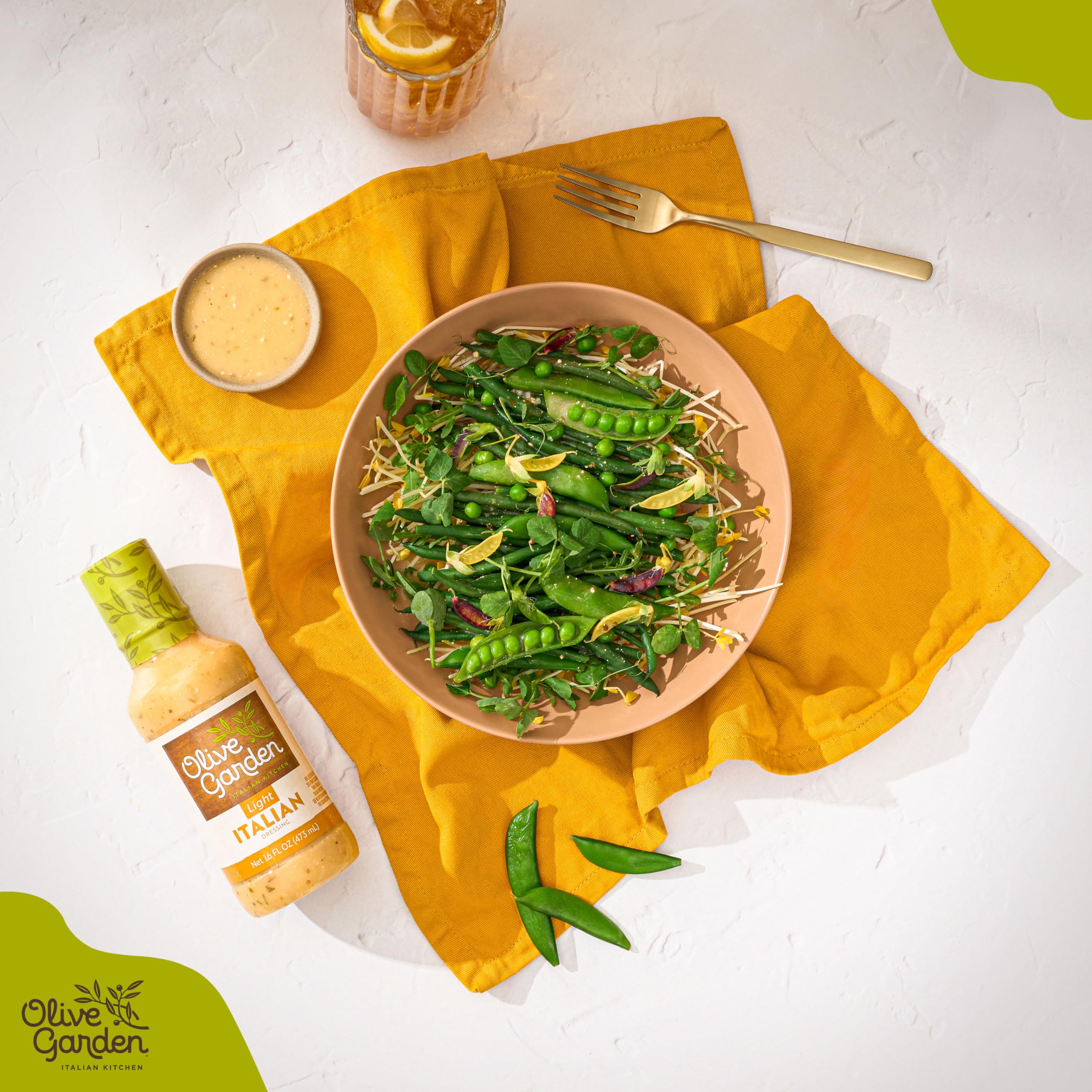 Olive Garden Light Italian Dressing on a fresh greens salad for a classic Italian finish.