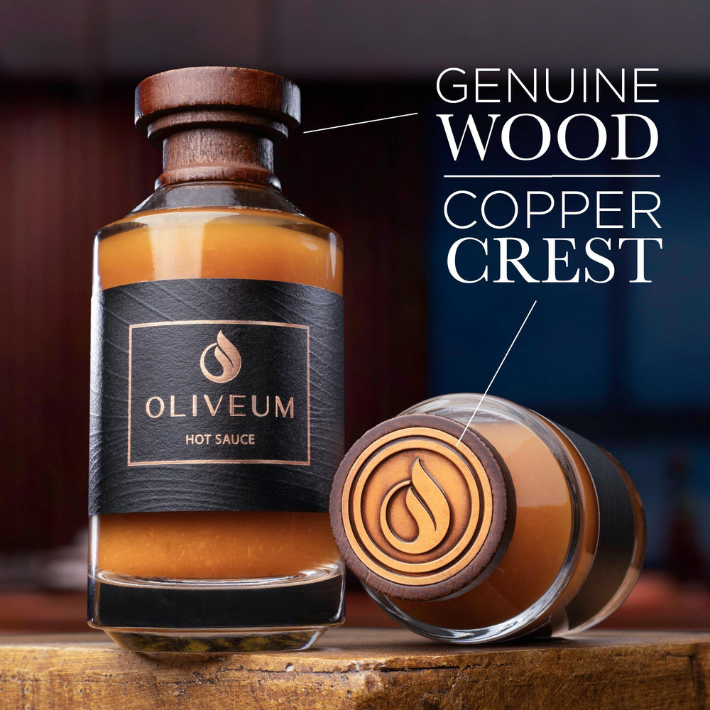 Oliveum bottle with walnut top and copper medallion elevates kitchen display and gifting