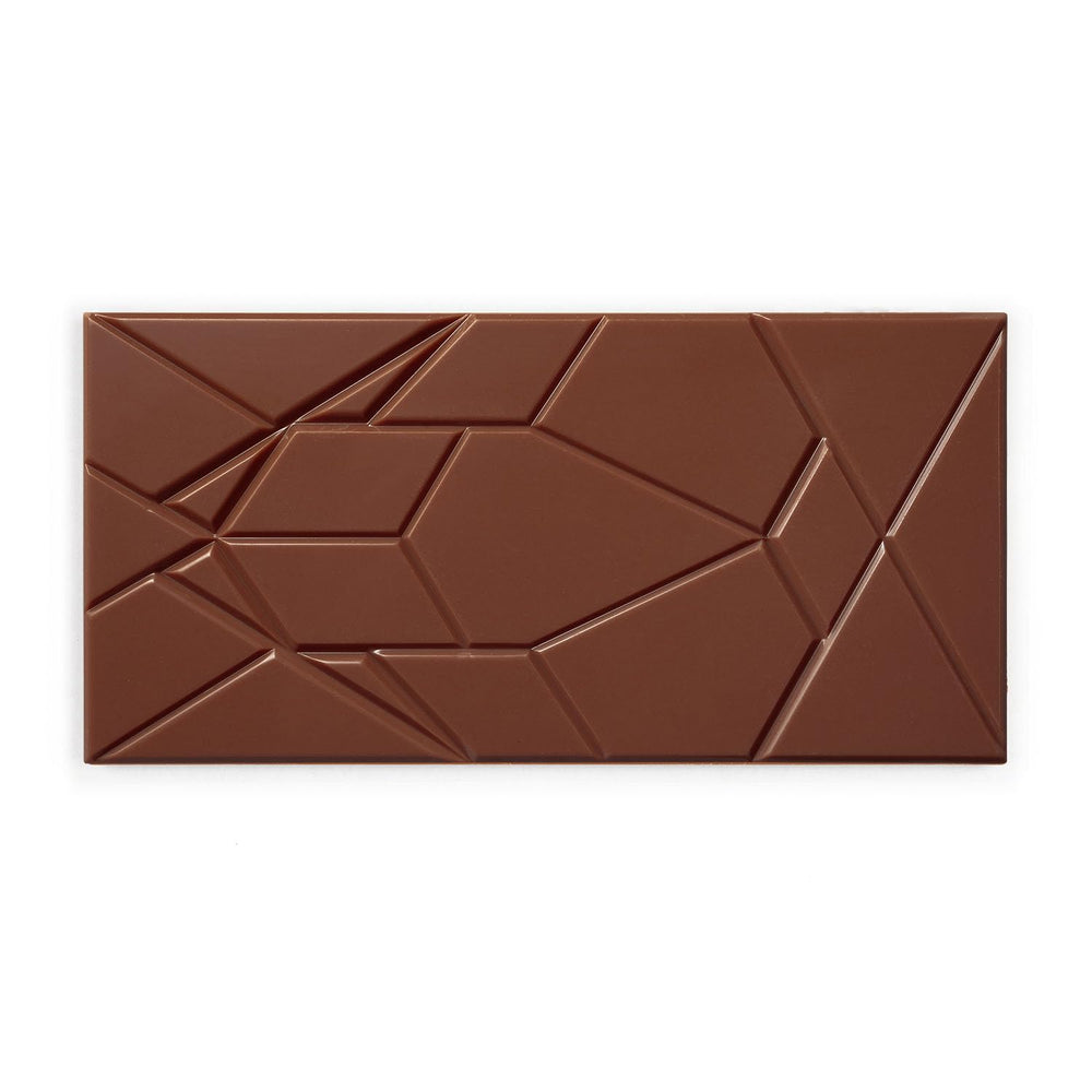 Close-up of Omnom Coffee + Milk texture shows smooth melt and hazelnut hints.