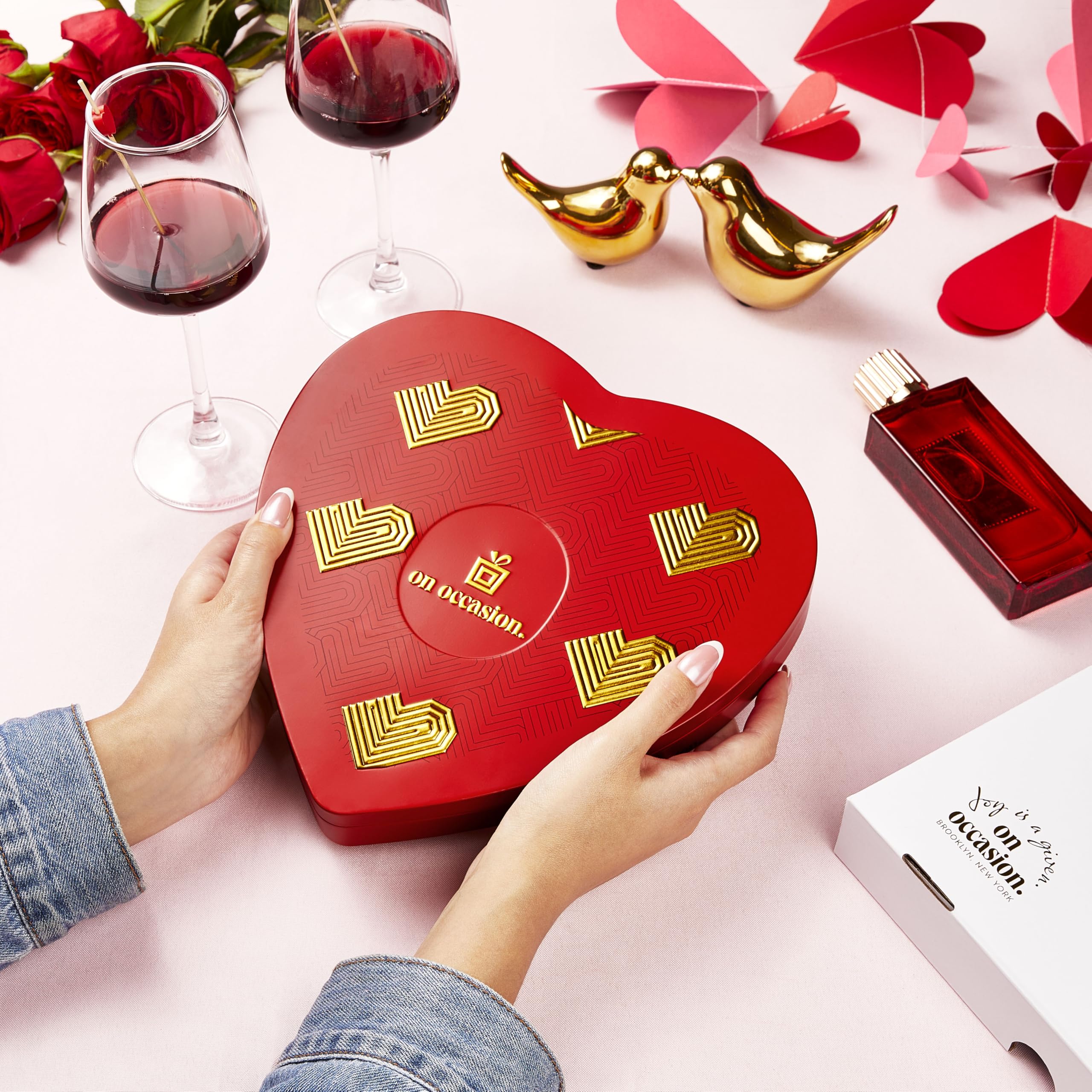 On Occasion red tin packaging showcases premium Easter chocolate presentation.
