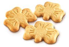 O'Neills Shamrock Shortbread cookies on a plate with tea, ideal for afternoon break.