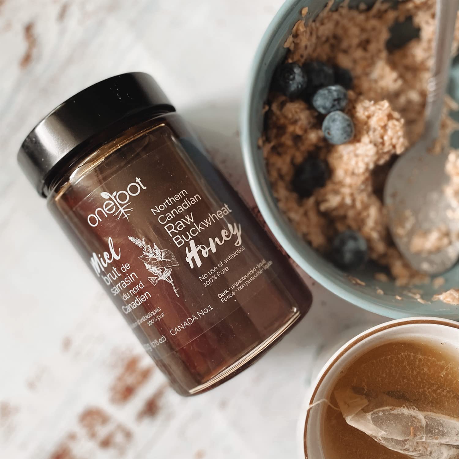 OneRoot Buckwheat Honey gift bottle suggests ethical sourcing.