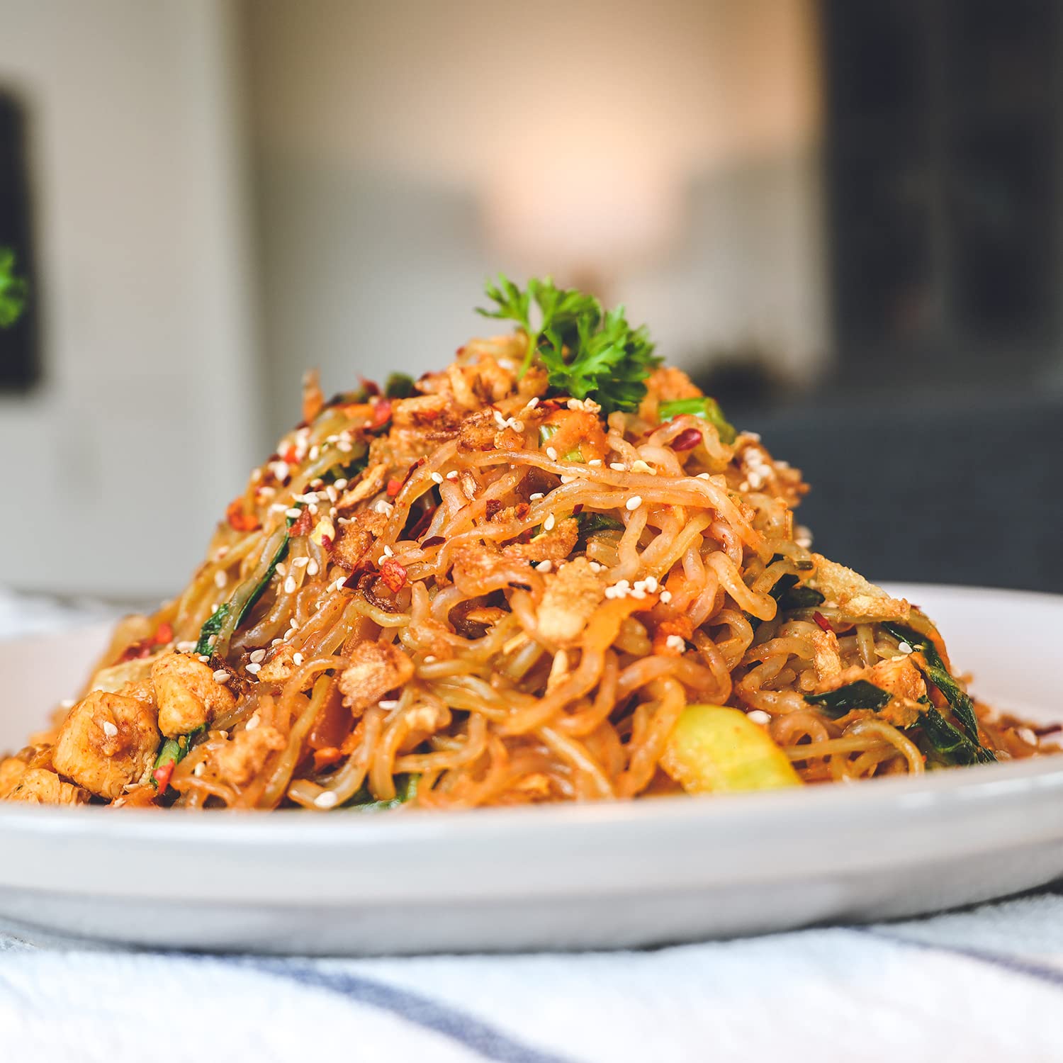 ONETANG noodles in wok or bowl demonstrate sauce absorption.
