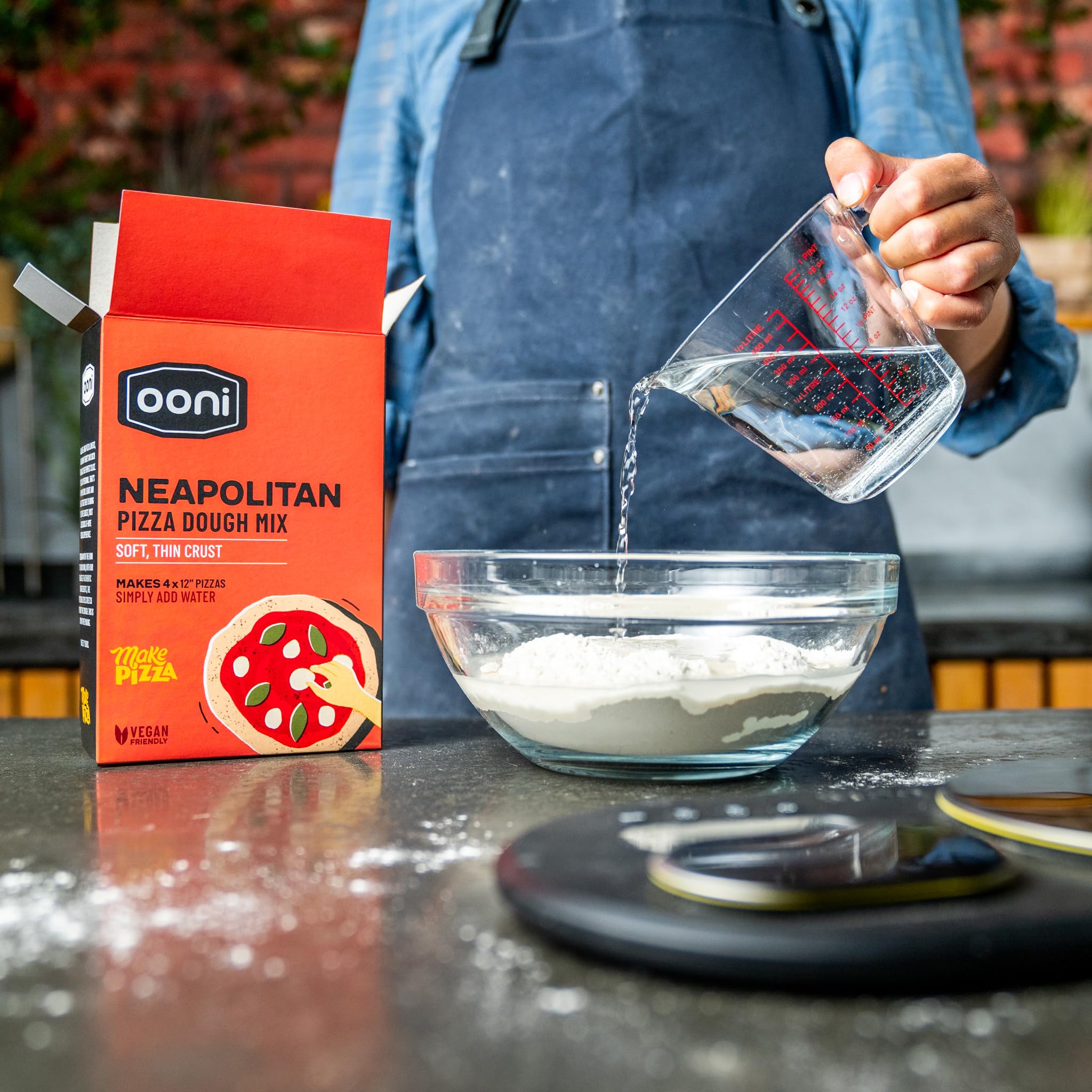 Toppings added to Ooni dough-based pizza for creative customization.