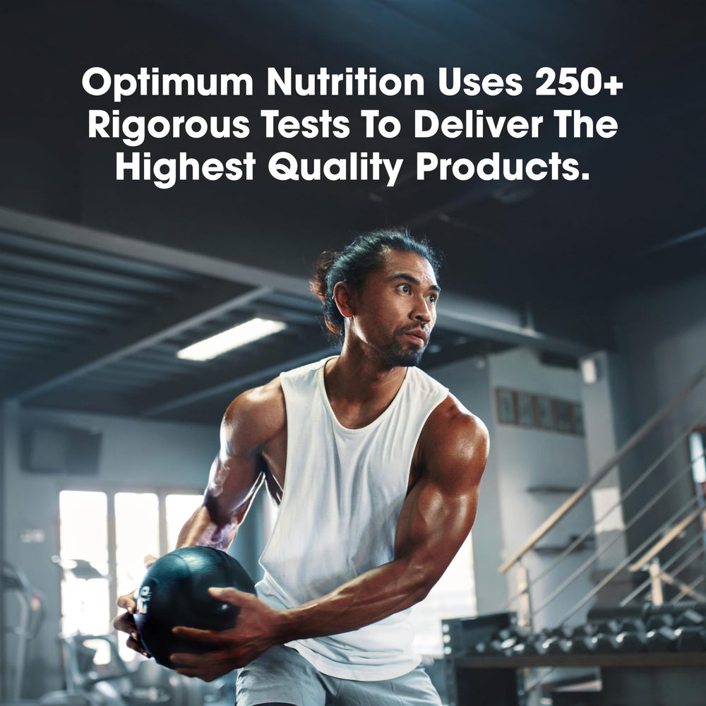 Optimum Nutrition chocolate flavor bottle beside glass and shaker.