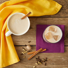 Hot latte with Oregon Chai concentrate and steam rising from the cup