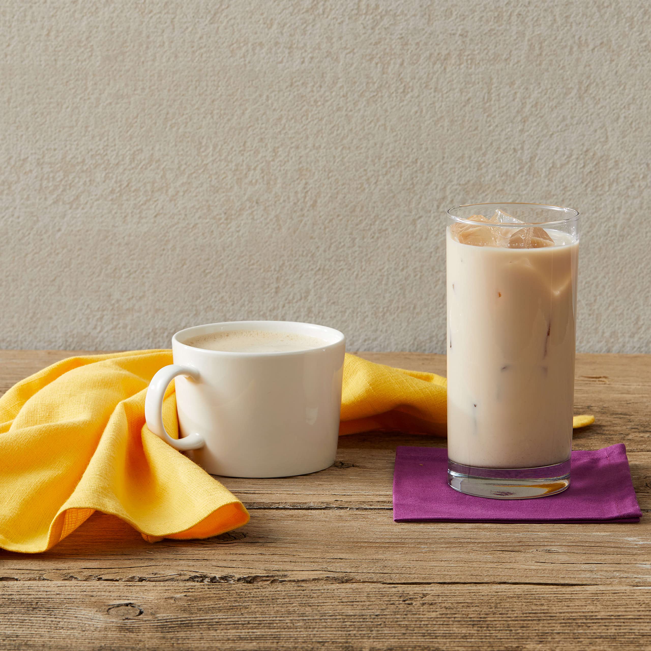 Oregon Chai Vanilla Concentrate on countertop with organic ingredients.