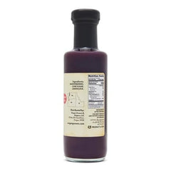 Oregon Growers Marionberry Syrup being poured over pancakes for a morning treat