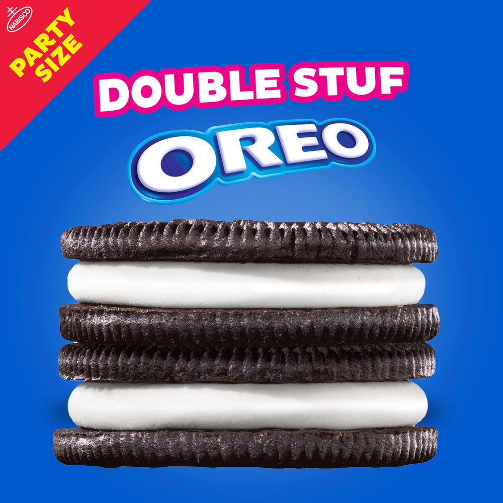 OREO Double Stuf cookies dunked in milk in a glass.