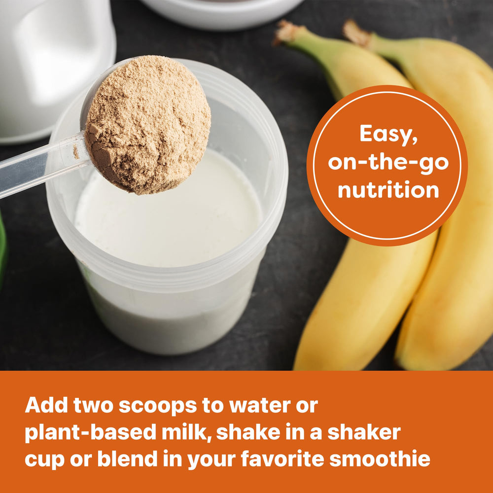 Orgain Justin's Nut Butter Protein Powder jar on kitchen counter for on-the-go.