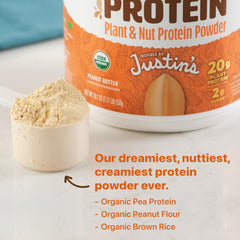 Orgain Justin's Nut Butter Protein Powder shake in a bottle ready to blend.