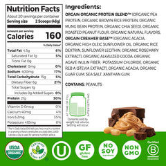 Orgain plant-based protein powder scoop beside a glass of blended shake.