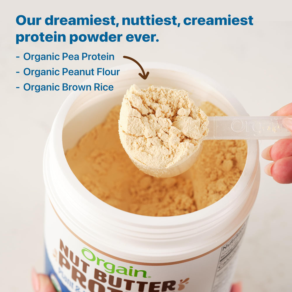 Scoop of Orgain Vanilla Almond Butter Protein Powder beside a smoothie bowl.