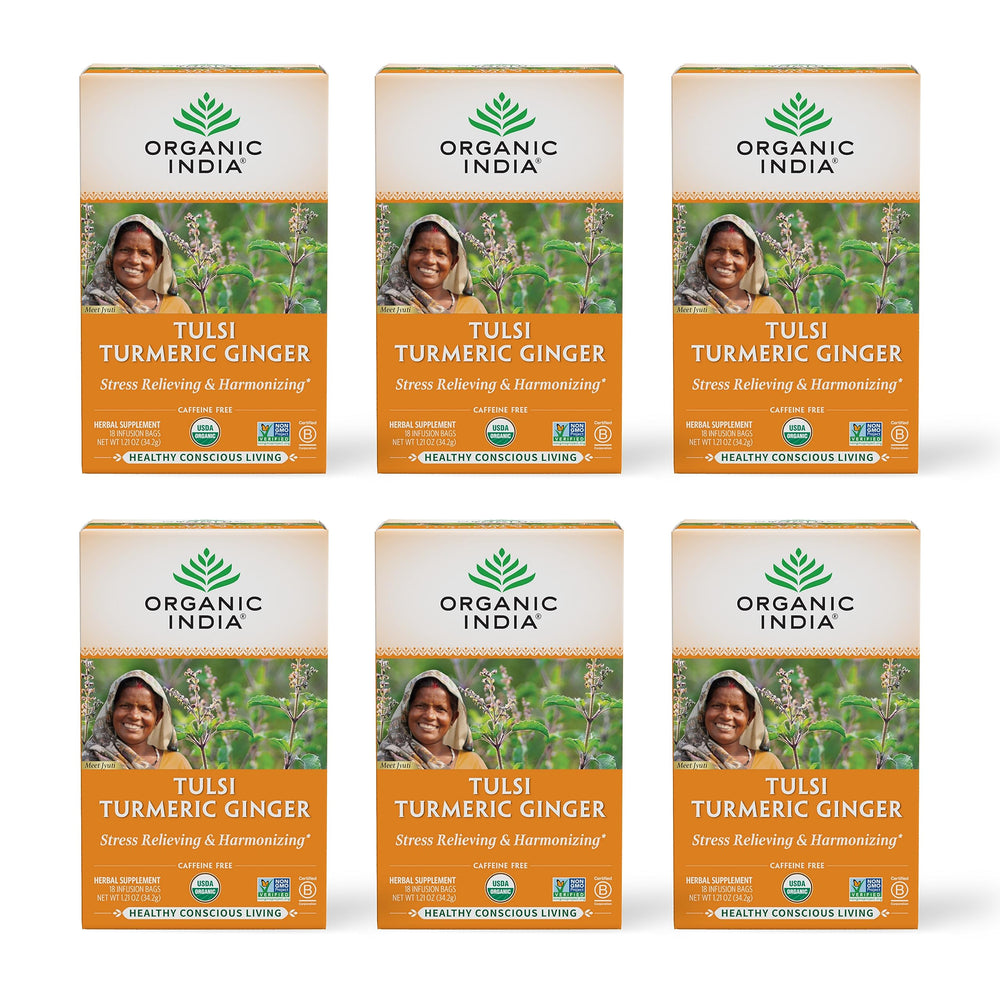 ORGANIC INDIA Tulsi Turmeric Ginger tea bag steeping in mug for daily calm.
