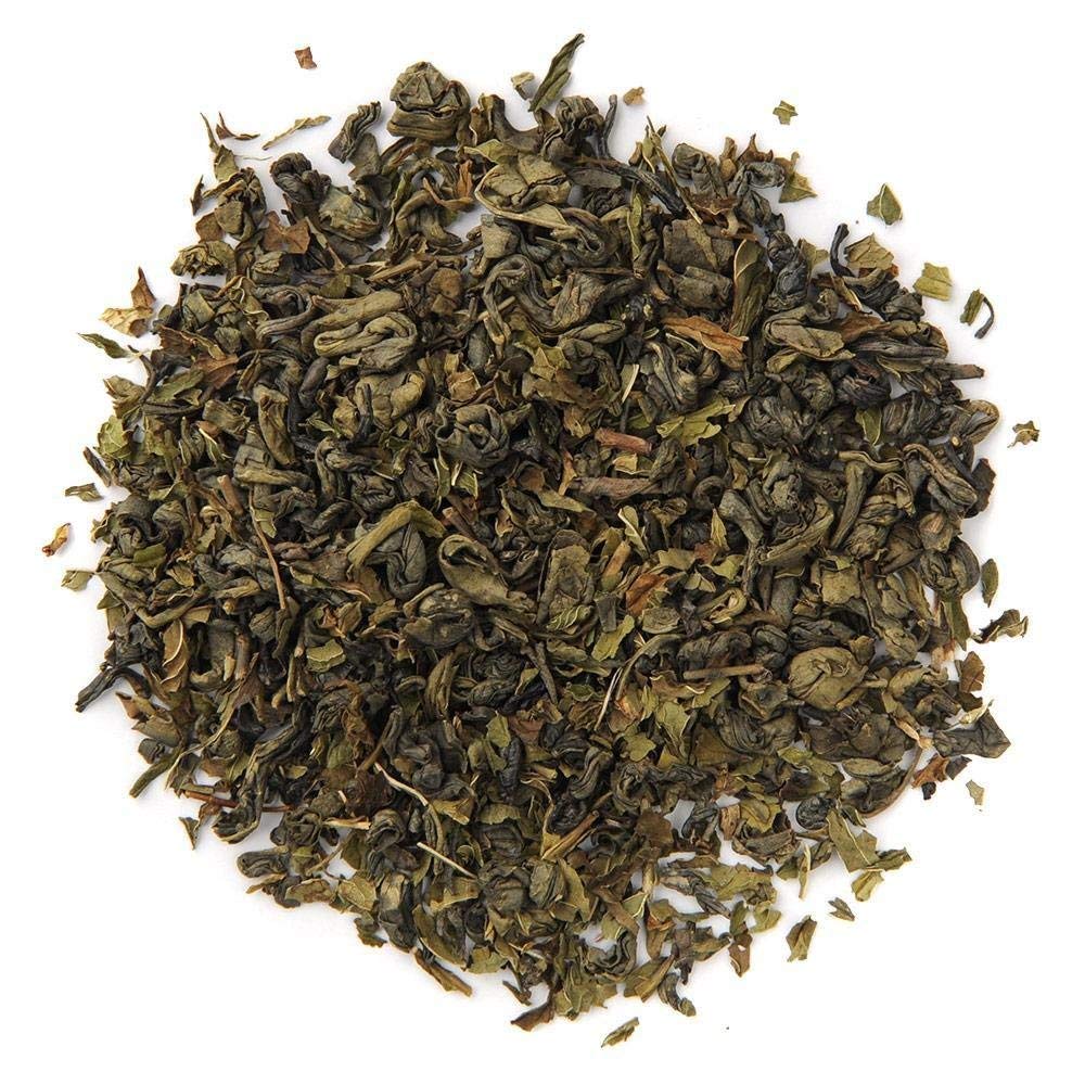 Organic Positively Tea close-up leaf texture conveys fresh aroma and vibrant green color.