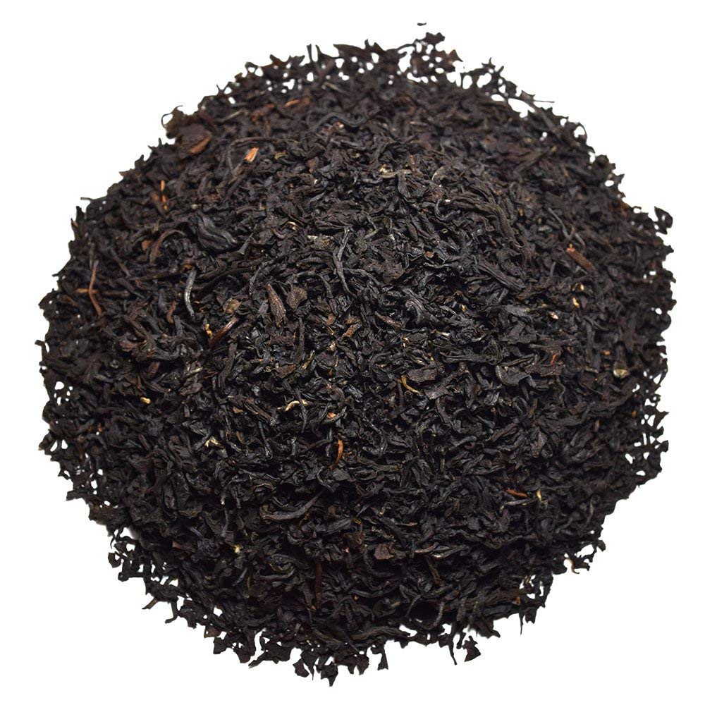Organic Positively Tea Company English Breakfast cup closeup reveals vibrant color.