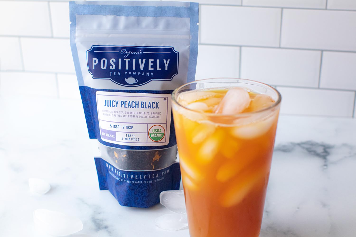 Organic Positively Tea Juicy Peach Black Tea 16oz bag label shows organic origin