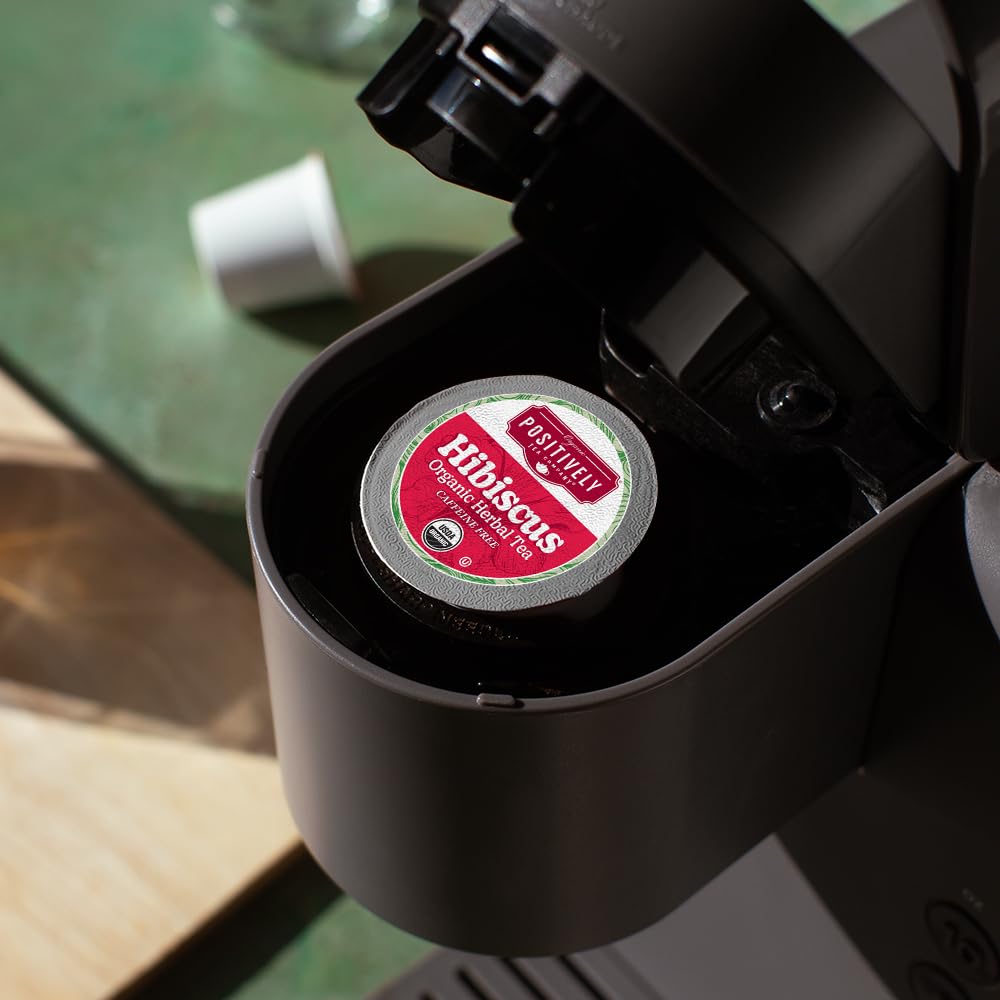 Single-serve Organic Positively Tea with recyclable packaging for convenience.