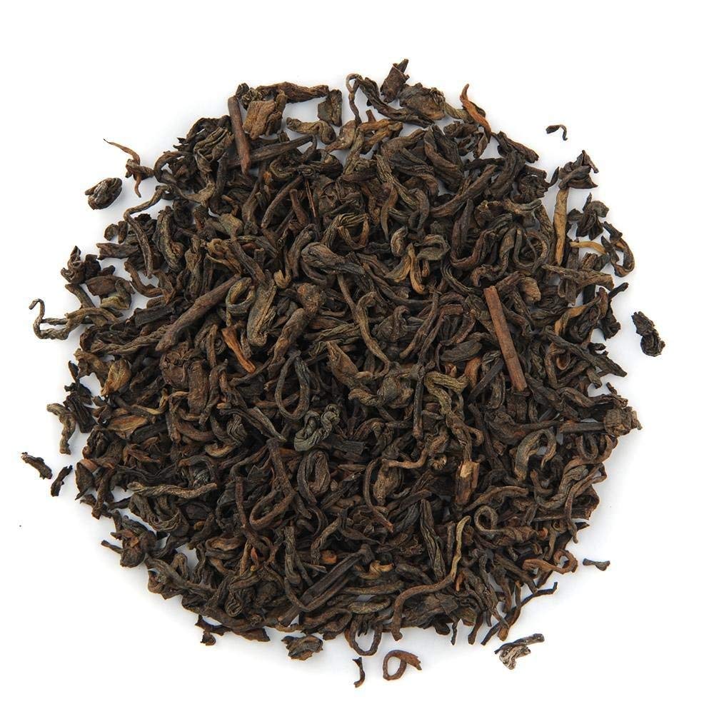 Organic Positively Tea Pu-Erh infused tea in cup demonstrates robust flavor.