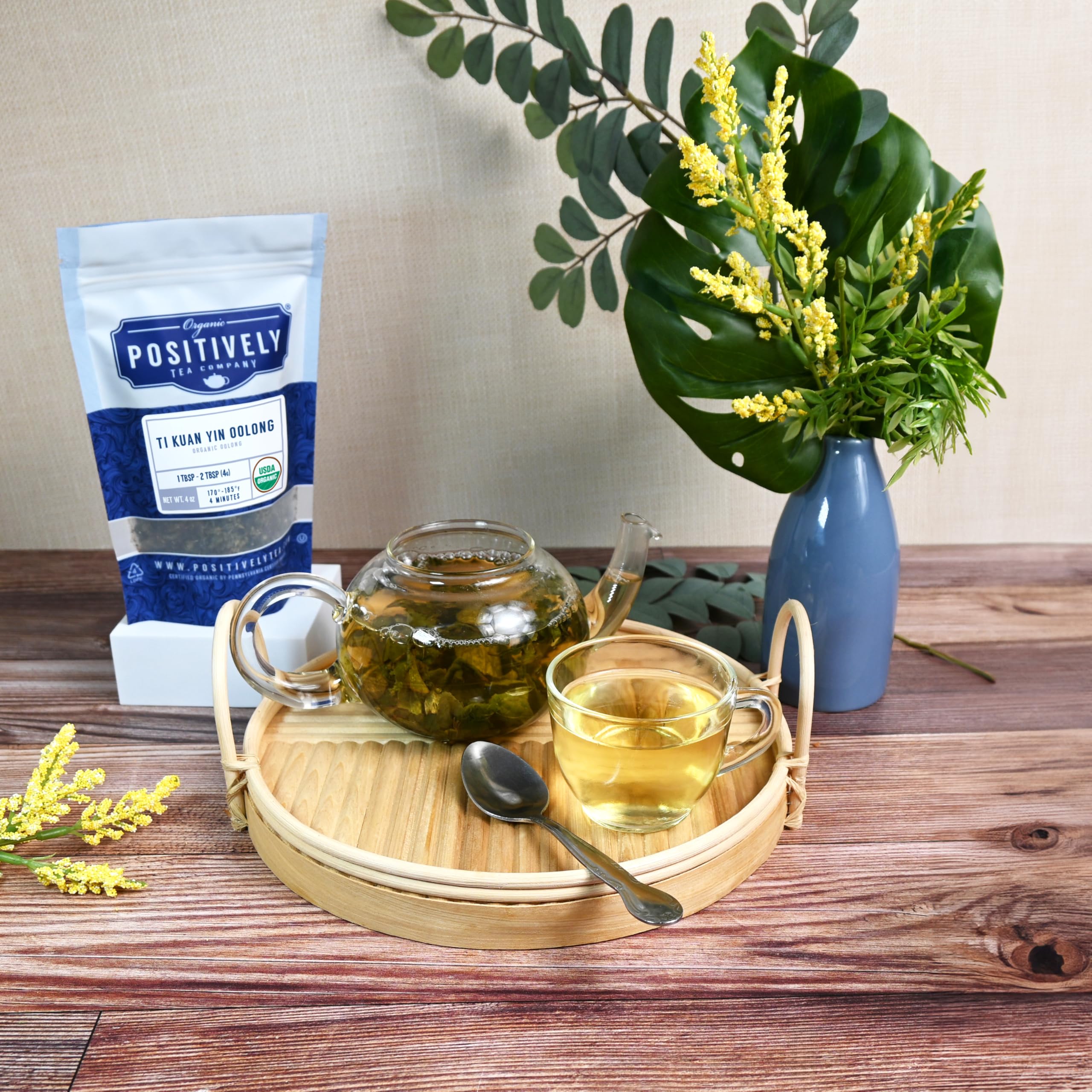 Loose Ti Kuan Yin leaves arranged for a relaxed tea ritual by Organic Positively Tea Company.
