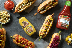 Dipping Organicville Mustard in a small bowl for versatile snacking