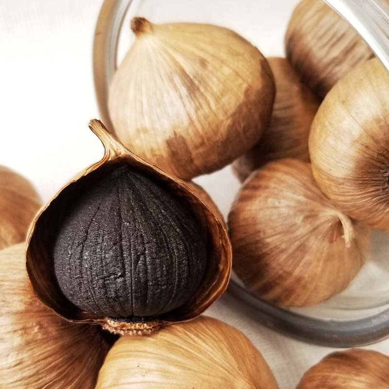 Orsky Black Garlic dish-ingredient shot suggests easy flavor boost in cooked meals.