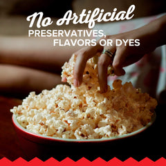 Microwave popcorn actively popping in the microwave.
